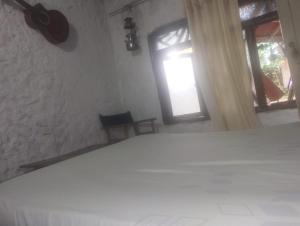Hostal La Cabaña客房内的一张或多张床位