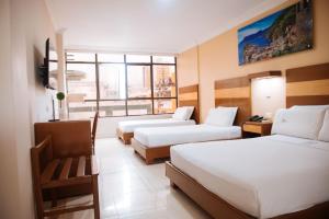 Voodi või voodid majutusasutuse Hotel Genova Centro toas