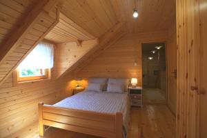 Postel nebo postele na pokoji v ubytování Brvnara Moj san - Log cabin My Dream