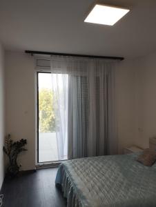 Posteľ alebo postele v izbe v ubytovaní Híd Köz Penthouses Apartman