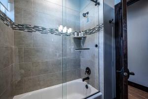 a bathroom with a shower with a white tub at Powder Mountain Escape in Eden +33 photos