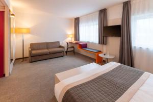 Postel nebo postele na pokoji v ubytování Best Western Colmar Expo
