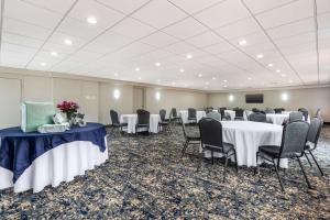 a conference room with tables and chairs and a screen at Best Western Plus Laurel in Laurel +31 photos