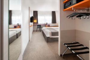 Postel nebo postele na pokoji v ubytování Best Western Colmar Expo