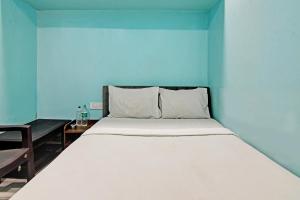 Postel nebo postele na pokoji v ubytování Hotel O NANDAN