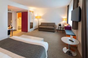 Postel nebo postele na pokoji v ubytování Best Western Colmar Expo