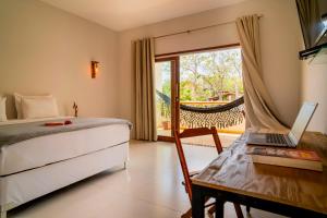 Cama ou camas em um quarto em Casa Suiça Brasileira