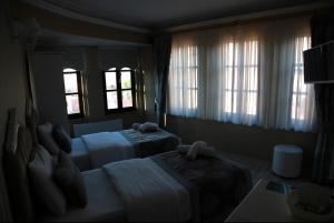 Postel nebo postele na pokoji v ubytování Kadi Konagi Thermal Hotel + 37 fotografií