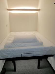 Postel nebo postele na pokoji v ubytování KOZAYO Hongdae Hostel