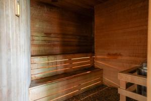a sauna with wood paneling and a wooden wall at King Bed, Balcony, Pool, Hot Tub, Sauna in Edgar