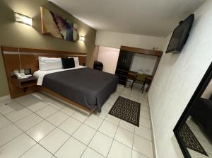 Postel nebo postele na pokoji v ubytování Hotel Interforum