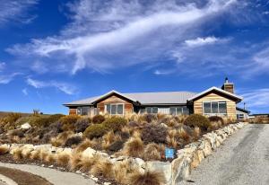 a house on the side of a road at Number 8 - Lake Tekapo in Lake Tekapo