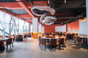 A restaurant or other place to eat at Sandstone Painting Handicraft Exchange Gallery Hotel