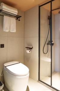 A bathroom at Sandstone Painting Handicraft Exchange Gallery Hotel