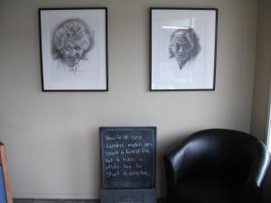 three framed pictures on a wall with a chair at Scenicland Motels in Greymouth +21 photos