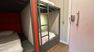 Hostel Distrito 011客房内的一张或多张床位