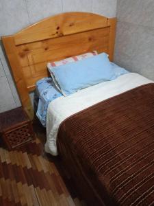 Postel nebo postele na pokoji v ubytování Agradable minidepartamento central en Ambato, para una a seis personas