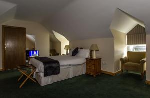 Voodi või voodid majutusasutuse Percy French Hotel toas
