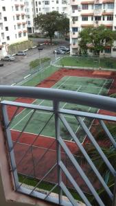 a view of a tennis court from a balcony at PD BATU 9 Cocobay Resort Condominium in Kampong Tanah Merah