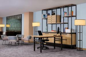 an office with a desk with chairs and a computer at Four Points by Sheraton Batam in Nagoya +22 photos