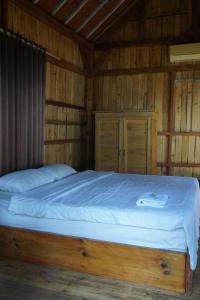 Postel nebo postele na pokoji v ubytování Kura Kura Beach