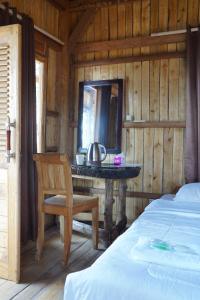 Postel nebo postele na pokoji v ubytování Kura Kura Beach