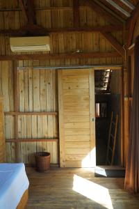 Postel nebo postele na pokoji v ubytování Kura Kura Beach