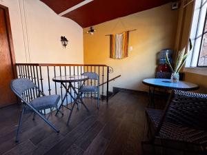 a room with two tables and chairs and a window at Vista Reforma in Guanajuato +54 photos