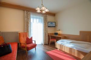 Postel nebo postele na pokoji v ubytování Haus Friedrichsburg - Bergbahnen von Mai bis November inklusive