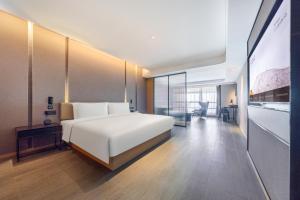 Tempat tidur dalam kamar di Atour Hotel Changsha Xingsha Economic Development Zone Sanyi Road