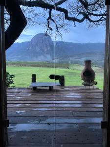 a view of a table and a vase on a porch at Hangar 5 La Casita del Arbol in San Lucas del Pulque