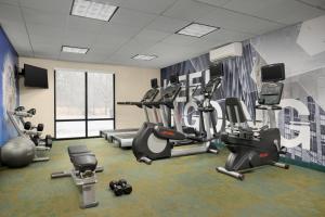 a gym with treadmills and exercise equipment in a room at SpringHill Suites Boston Peabody in Peabody