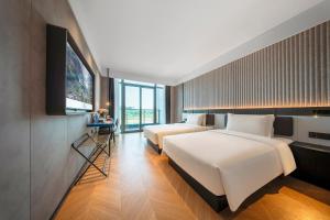 Postel nebo postele na pokoji v ubytování Atour Light Hotel Chongqing Hechuan Sports Center