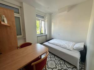 Postel nebo postele na pokoji v ubytování Gästehaus LINH