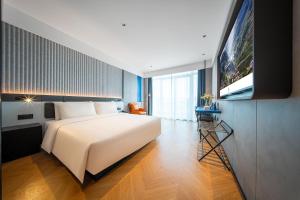 TV a/nebo společenská místnost v ubytování Atour Light Hotel Chongqing Hechuan Sports Center