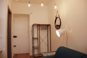 a living room with a table and a mirror and a shelf at "Le Massena" Plein Centre, Neuf, Proche gare in Menton