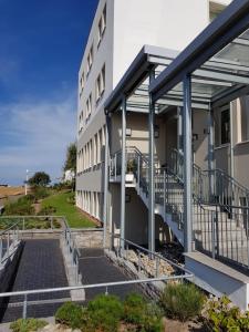 a building with stairs leading up to it at Hus up Dün in Norderney