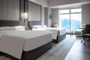 Postel nebo postele na pokoji v ubytování Chongqing Marriott Hotel
