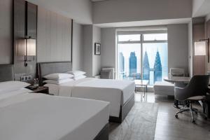 Postel nebo postele na pokoji v ubytování Chongqing Marriott Hotel