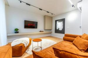 Et tv og/eller underholdning på Central Epic Apartment-self check in