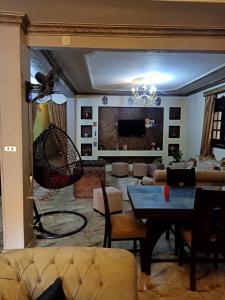 a living room with a couch and a table at Big pyramid view house in Cairo +9 photos