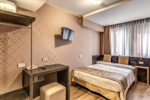 Postel nebo postele na pokoji v ubytování Hotel Belle Arti