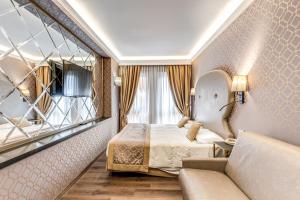 Postel nebo postele na pokoji v ubytování Hotel Belle Arti