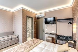 Postel nebo postele na pokoji v ubytování Hotel Belle Arti