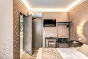 TV a/nebo společenská místnost v ubytování Hotel Belle Arti