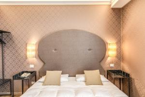 Postel nebo postele na pokoji v ubytování Hotel Belle Arti