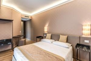 TV a/nebo společenská místnost v ubytování Hotel Belle Arti