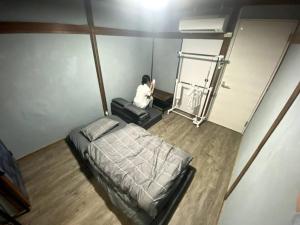 Postel nebo postele na pokoji v ubytování Layover 一軒家貸し切り物件 大阪と京都と神戸にアクセス抜群