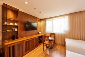 TV a/nebo společenská místnost v ubytování Hotel Uri&