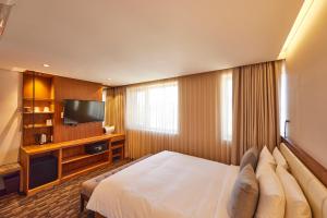 TV a/nebo společenská místnost v ubytování Hotel Uri&
